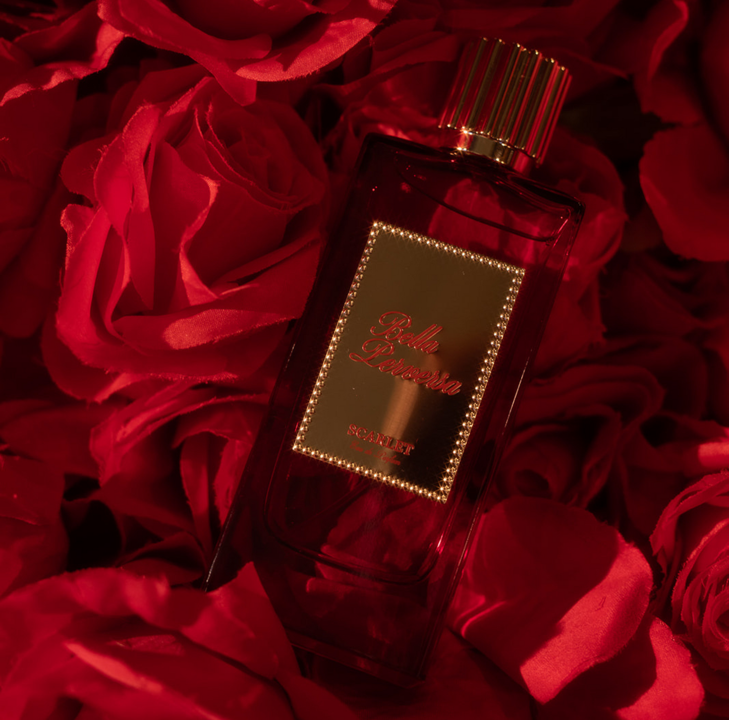 Scarlet Eau de Parfum laying softly on a bed of roses.